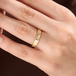 Model wearing a 14k gold vermeil Northstar ring with a cubic zirconia center stone and starburst detailing, minimalist celestial ring for women.
