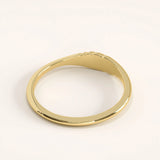 Side angle of 14k gold vermeil small signet ring showing the sculpted twisted detailing and refined craftsmanship.
