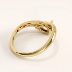 Gold ring with a textured band on a white background