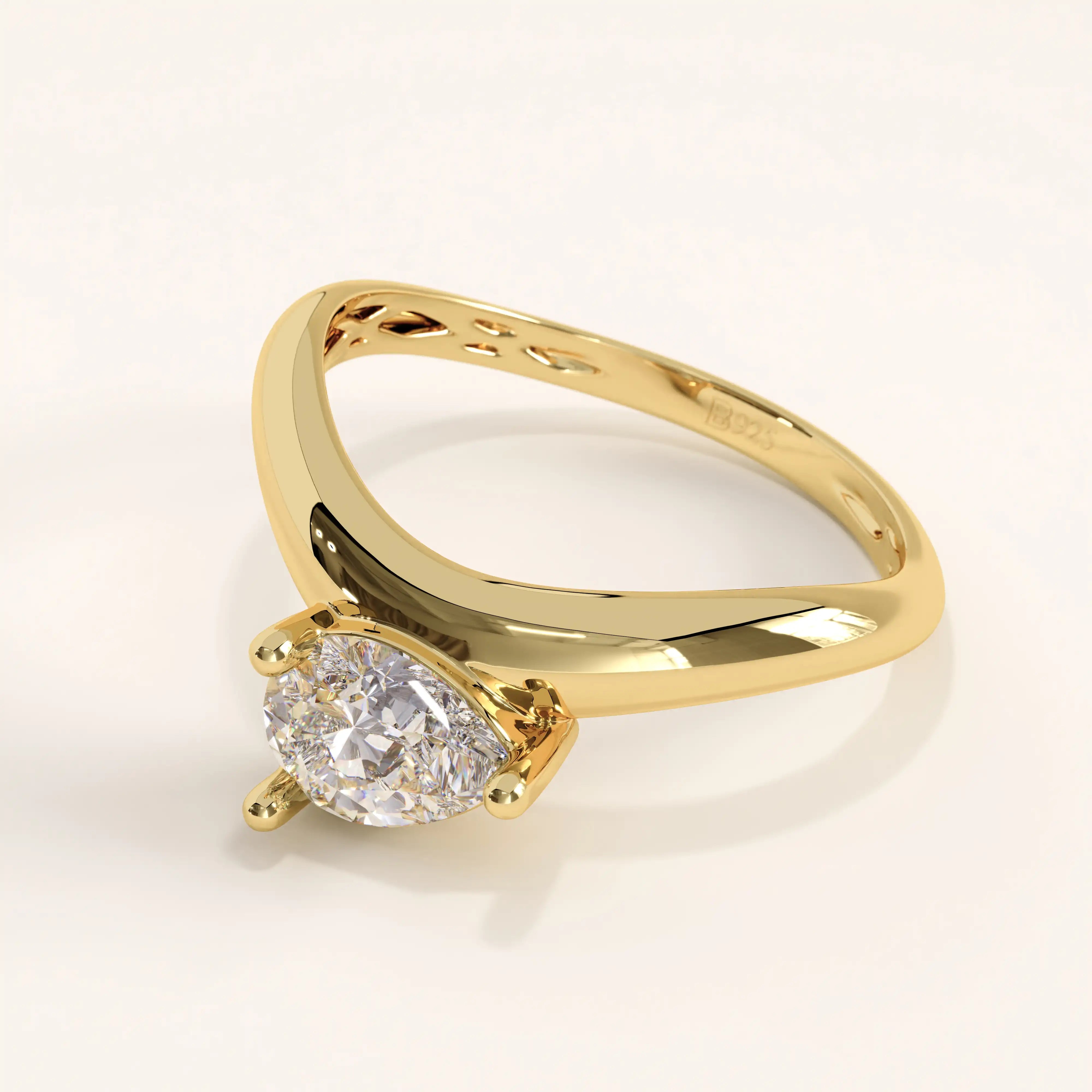 Gold ring with a diamond on a white background