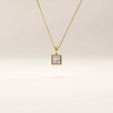14k gold vermeil princess solitaire necklace featuring a square-cut cubic zirconia set in a sleek bezel frame for a modern, timeless look.
