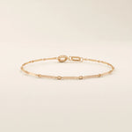 14k rose gold bracelet with alternating flat bar and oval cable chain links for a refined minimalist style.
