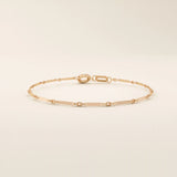 14k rose gold bracelet with alternating flat bar and oval cable chain links for a refined minimalist style.
