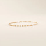 14k rose gold bracelet with delicate textured circle links in a shimmering starburst motif.

