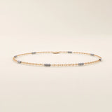 14k rose gold bracelet with oval chain links and contrasting white gold faceted bar details.
