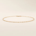14k rose gold scroll chain bracelet designed with rectangular scrollwork links in a repeating elegant pattern.
