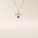 14k solid gold Aquarius zodiac symbol pendant necklace with a deep purple amethyst. Minimalist astrology birthstone jewelry.