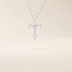 14k solid gold Aries zodiac symbol pendant necklace with a sparkling clear moissanite, minimalist astrology jewelry.