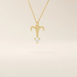 14k solid gold Aries zodiac symbol pendant necklace with a sparkling clear moissanite, minimalist astrology jewelry.