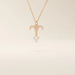 14k solid gold Aries zodiac symbol pendant necklace with a sparkling clear moissanite, minimalist astrology jewelry.