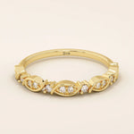14k solid gold Art Deco-inspired stacking wedding ring with pave-set moissanites. Geometric and elegant design perfect for layering.