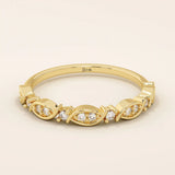 14k solid gold Art Deco-inspired stacking wedding ring with pave-set moissanites. Geometric and elegant design perfect for layering.