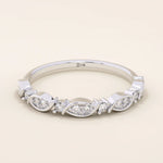 14k solid gold Art Deco-inspired stacking wedding ring with pave-set moissanites. Geometric and elegant design perfect for layering.