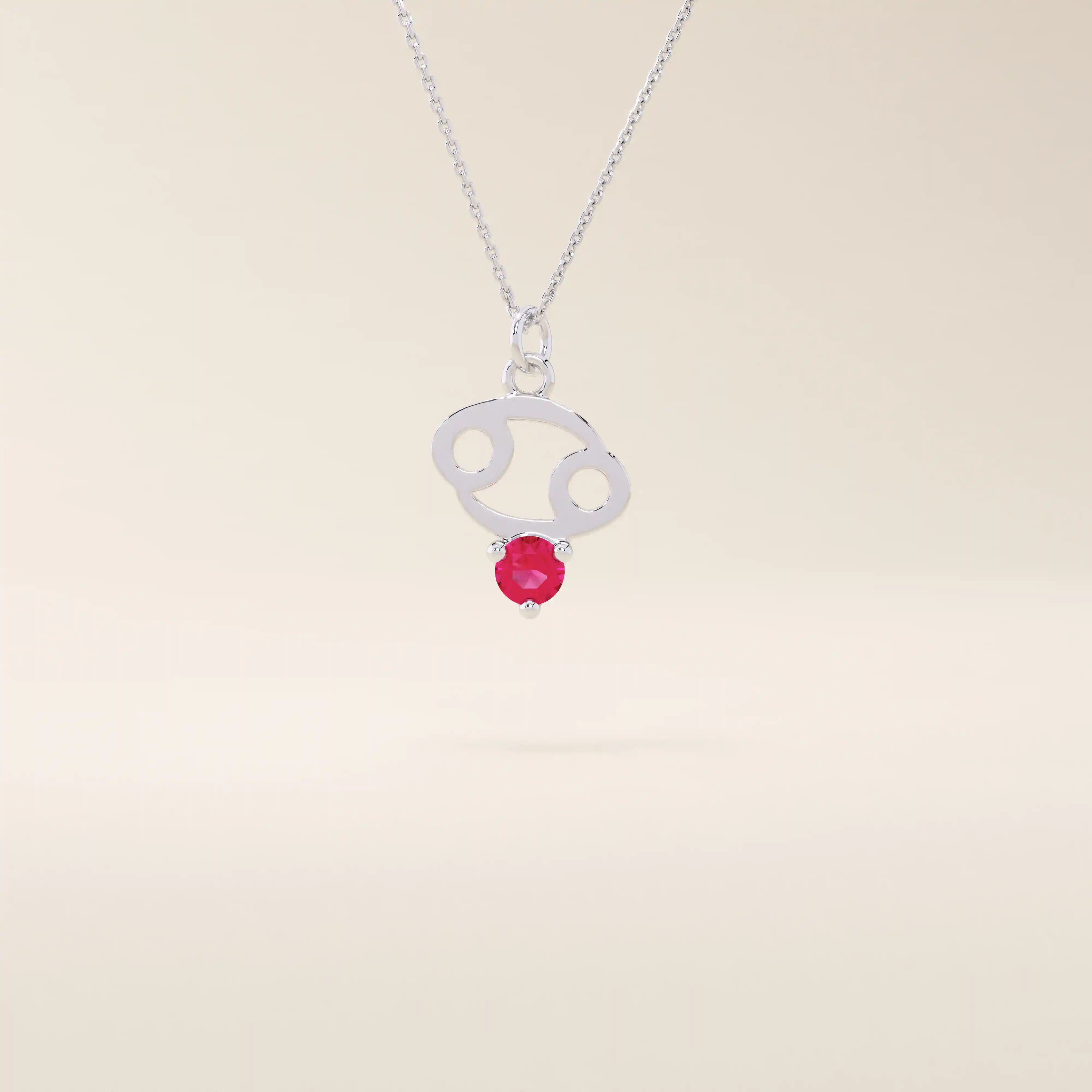 14k solid gold Cancer zodiac pendant necklace featuring a vibrant lab-grown ruby birthstone. A personalized and meaningful zodiac jewelry piece.