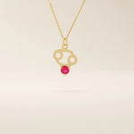 14k solid gold Cancer zodiac pendant necklace featuring a vibrant lab-grown ruby birthstone. A personalized and meaningful zodiac jewelry piece.
