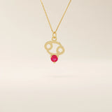 14k solid gold Cancer zodiac pendant necklace featuring a vibrant lab-grown ruby birthstone. A personalized and meaningful zodiac jewelry piece.