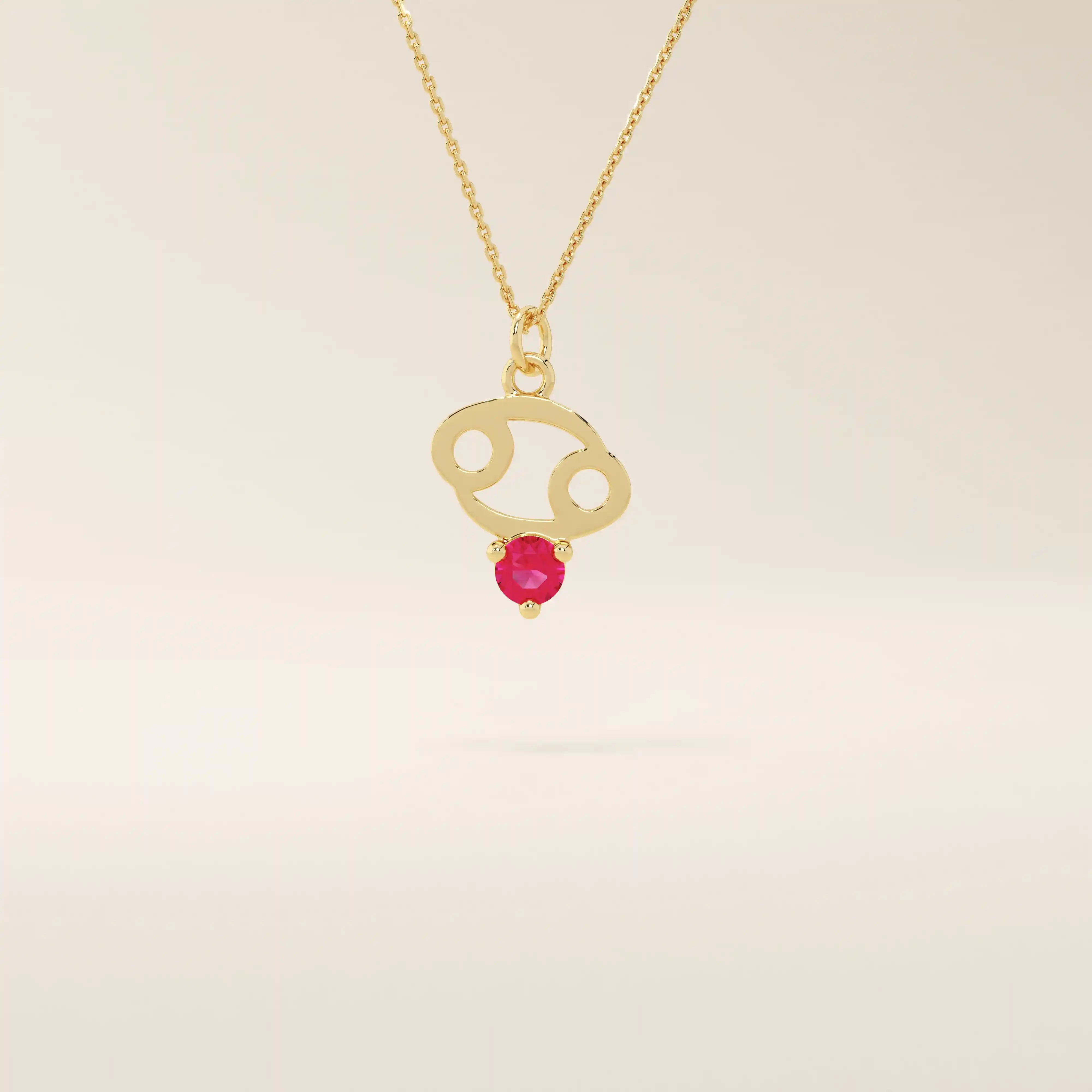 14k solid gold Cancer zodiac pendant necklace featuring a vibrant lab-grown ruby birthstone. A personalized and meaningful zodiac jewelry piece.