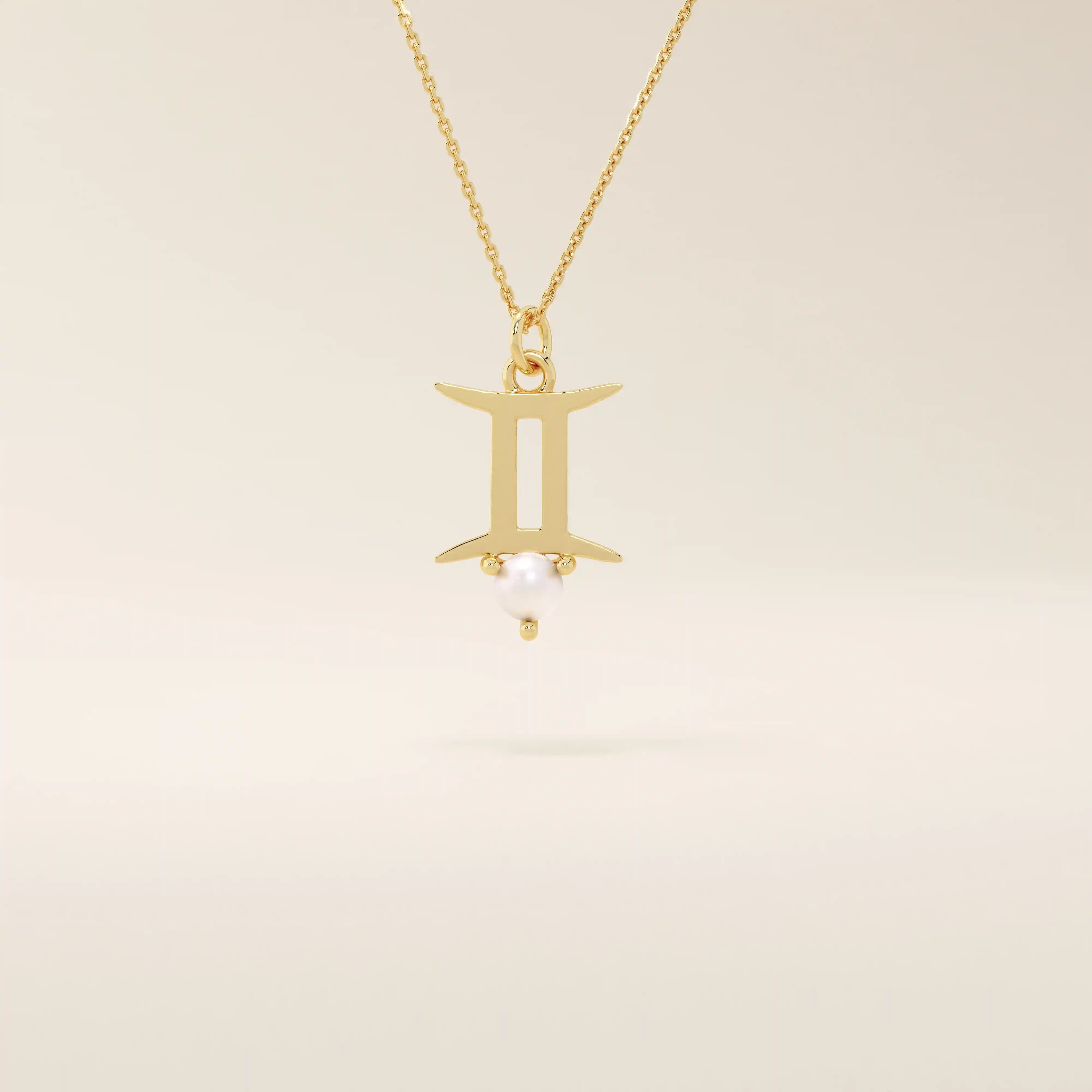 14k solid gold Gemini zodiac symbol pendant necklace with a natural pearl charm, minimalist celestial design.