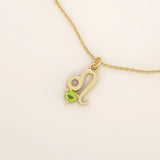 14k solid gold Leo zodiac symbol pendant necklace with a round green peridot, minimalist astrology birthstone jewelry.