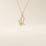 14k solid gold Leo zodiac symbol pendant necklace with a round green peridot, minimalist astrology birthstone jewelry.