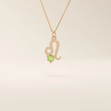 14k solid gold Leo zodiac symbol pendant necklace with a round green peridot, minimalist astrology birthstone jewelry.