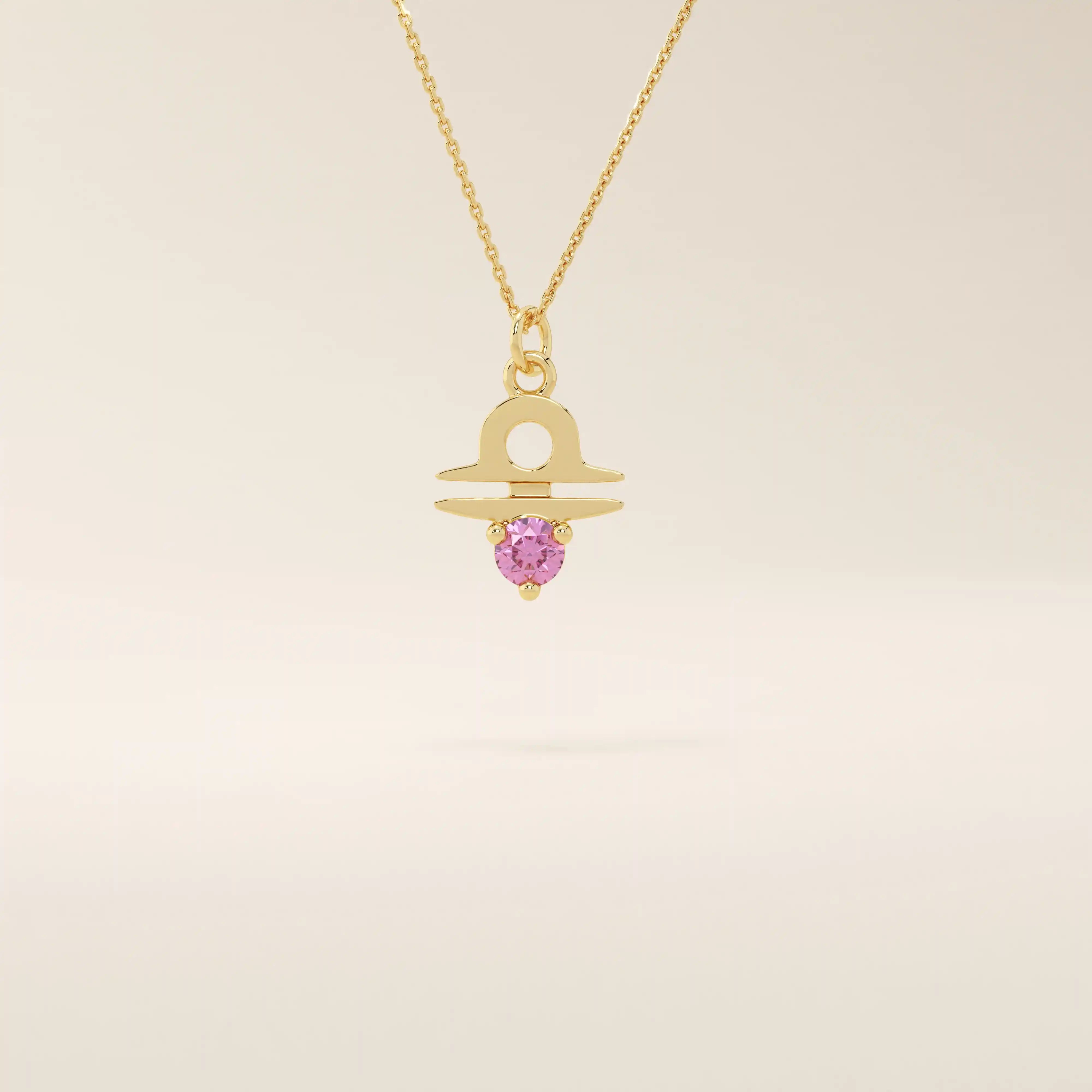 14k solid gold Libra zodiac symbol pendant necklace with a vibrant pink tourmaline. Minimalist astrology birthstone jewelry.