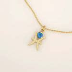 14k solid gold Pisces zodiac symbol pendant necklace with a round aquamarine, minimalist astrology birthstone jewelry.