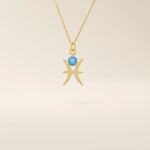 14k solid gold Pisces zodiac symbol pendant necklace with a round aquamarine, minimalist astrology birthstone jewelry.