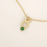 14k solid gold Taurus zodiac pendant necklace with a rich green emerald birthstone. A personalized and elegant zodiac accessory.