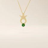 14k solid gold Taurus zodiac pendant necklace with a rich green emerald birthstone. A personalized and elegant zodiac accessory.