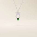 14k solid gold Taurus zodiac pendant necklace with a rich green emerald birthstone. A personalized and elegant zodiac accessory.
