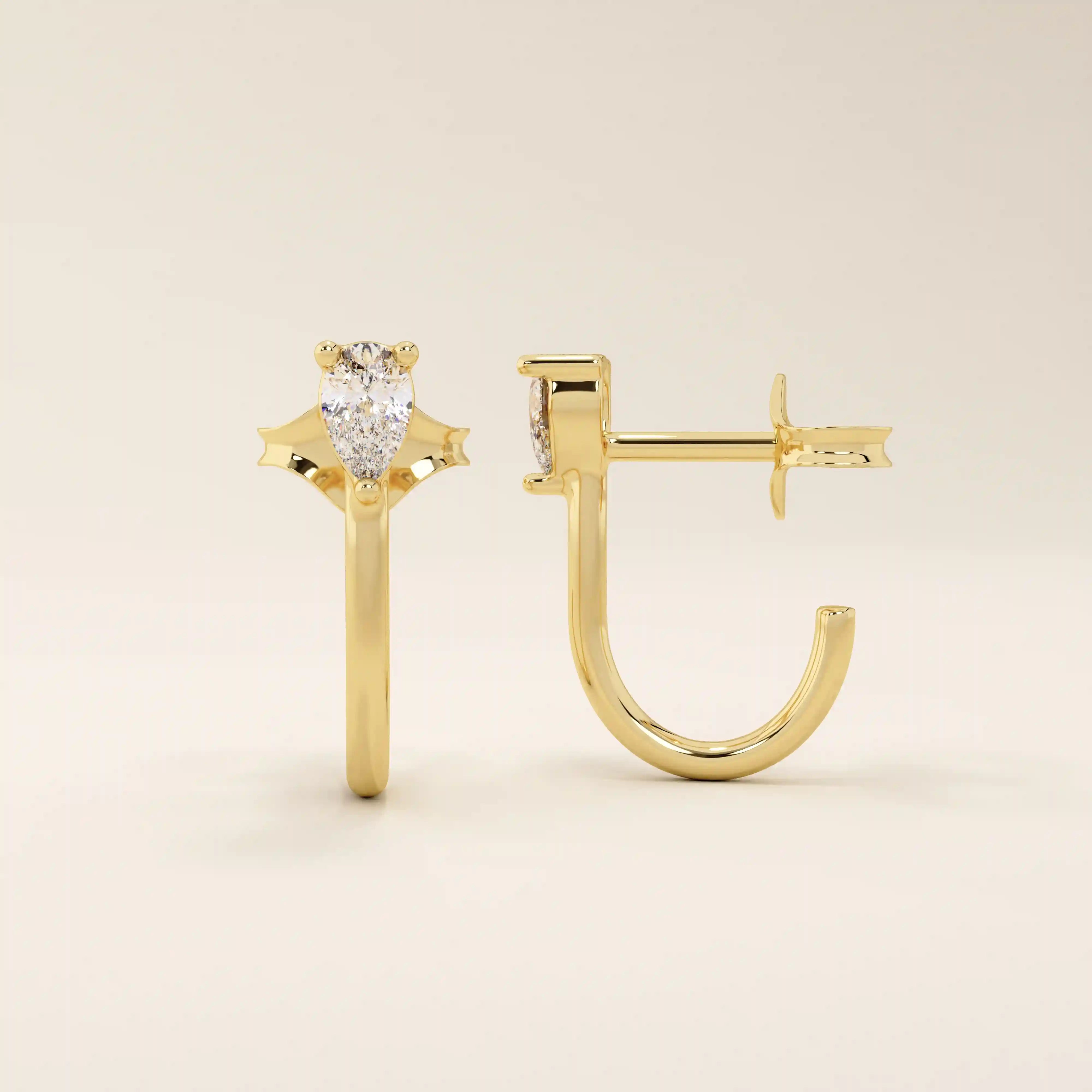 14k solid gold U-shaped stud earrings featuring a front-facing pear-cut moissanite. A unique and modern earring design. Perfect for daily wear or special occasions.