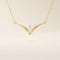 14k solid gold V-shape necklace with a marquise-cut moissanite at the center. Unique and modern gold necklace design. Dainty and minimalist jewelry for everyday wear.