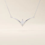 14k solid gold V-shape necklace with a marquise-cut moissanite at the center. Unique and modern gold necklace design. Dainty and minimalist jewelry for everyday wear.