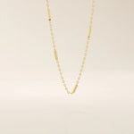 14k solid gold bar chain necklace with sleek horizontal links and a polished finish. A modern and minimal gold chain. Great for layering or wearing alone.