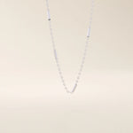 14k solid gold bar chain necklace with sleek horizontal links and a polished finish. A modern and minimal gold chain. Great for layering or wearing alone.