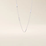 14k solid gold bar chain necklace with sleek horizontal links and a polished finish. A modern and minimal gold chain. Great for layering or wearing alone.