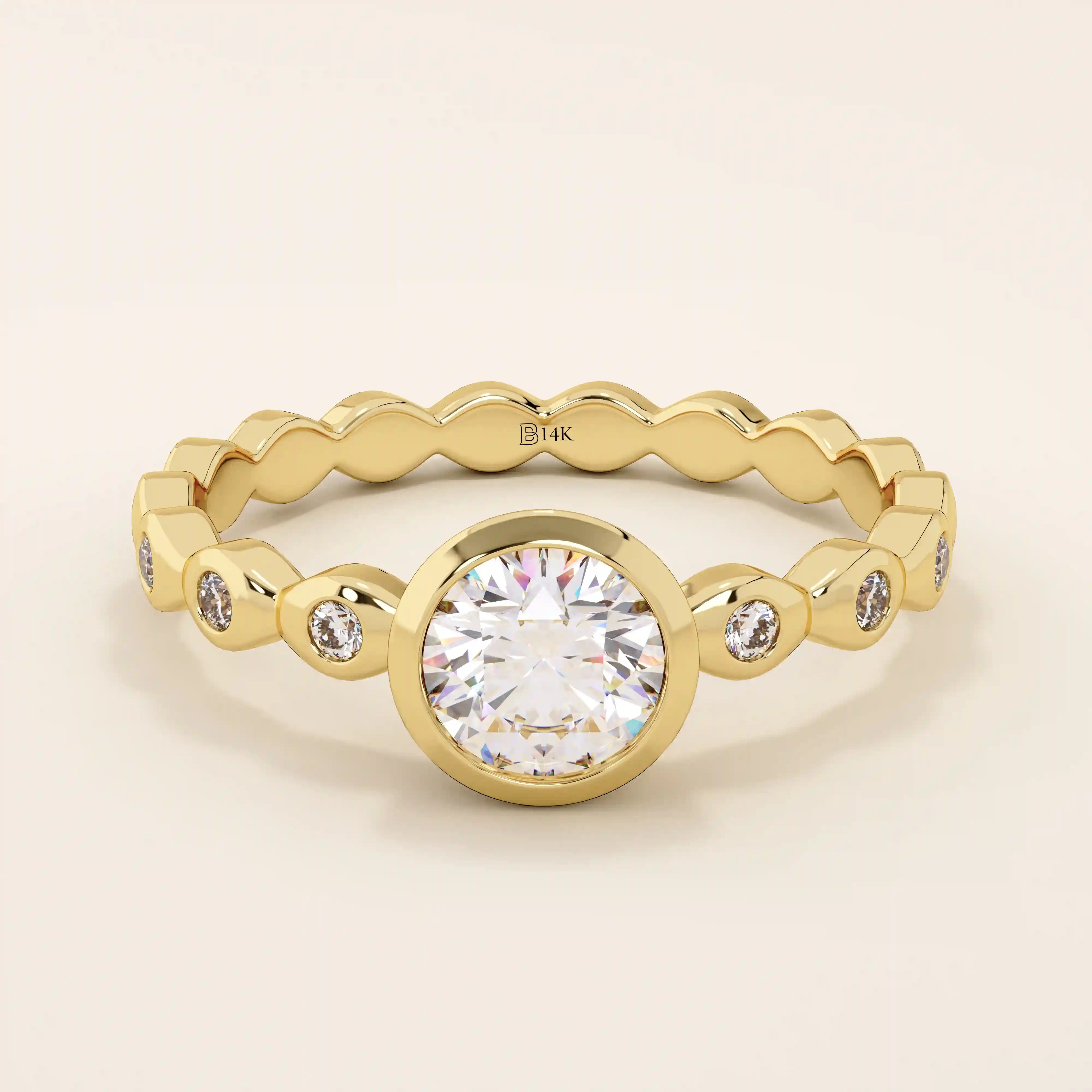 14k solid gold bezel-set solitaire engagement ring featuring a round moissanite and subtle detailing along the band. A modern twist on a classic style. Perfect for timeless proposals.