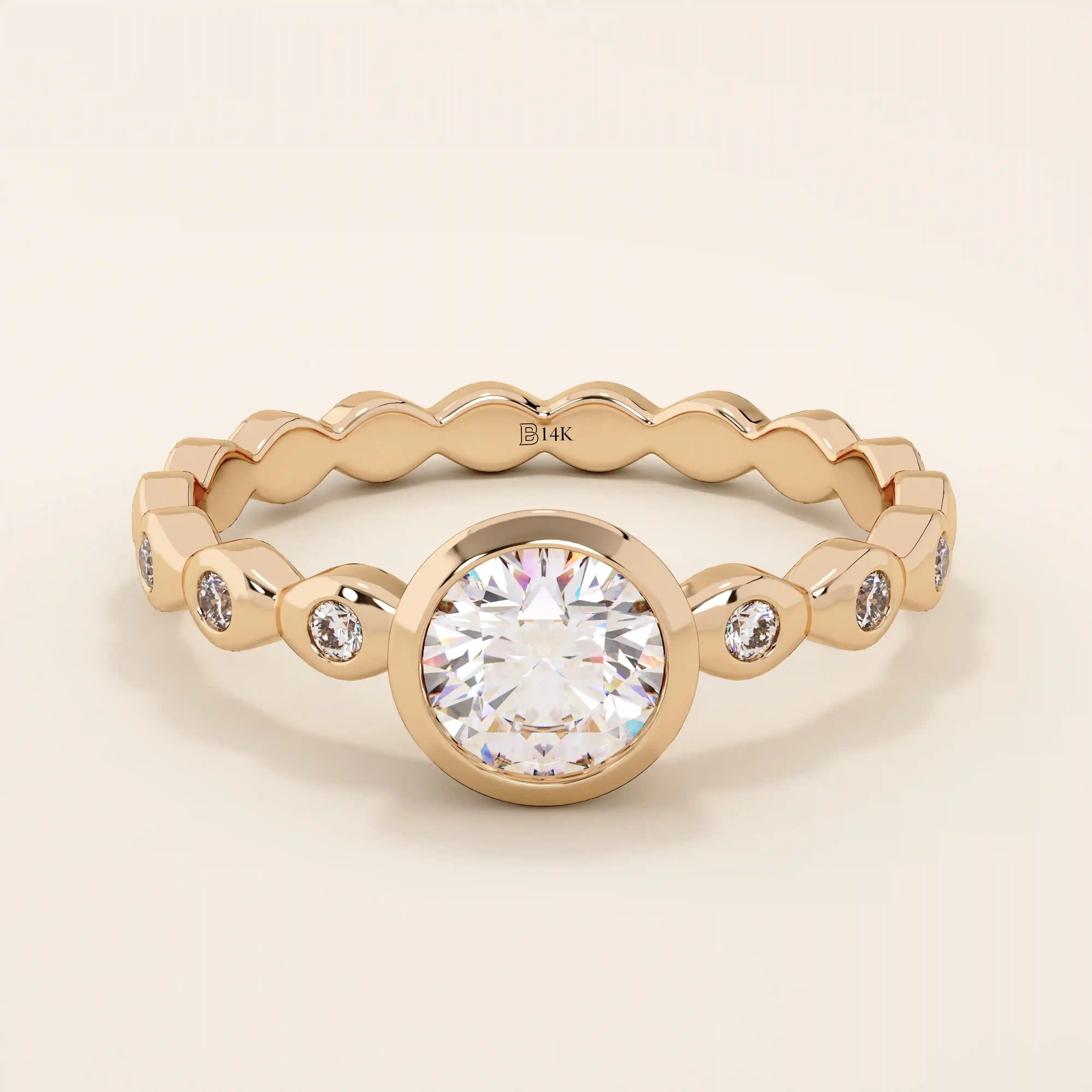 14k solid gold bezel-set solitaire engagement ring featuring a round moissanite and subtle detailing along the band. A modern twist on a classic style. Perfect for timeless proposals.