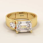 14k solid gold bold chunky Toi et Moi engagement ring featuring a prong-set emerald-cut moissanite and round-cut moissanites half bezel set. Modern, statement bridal design.