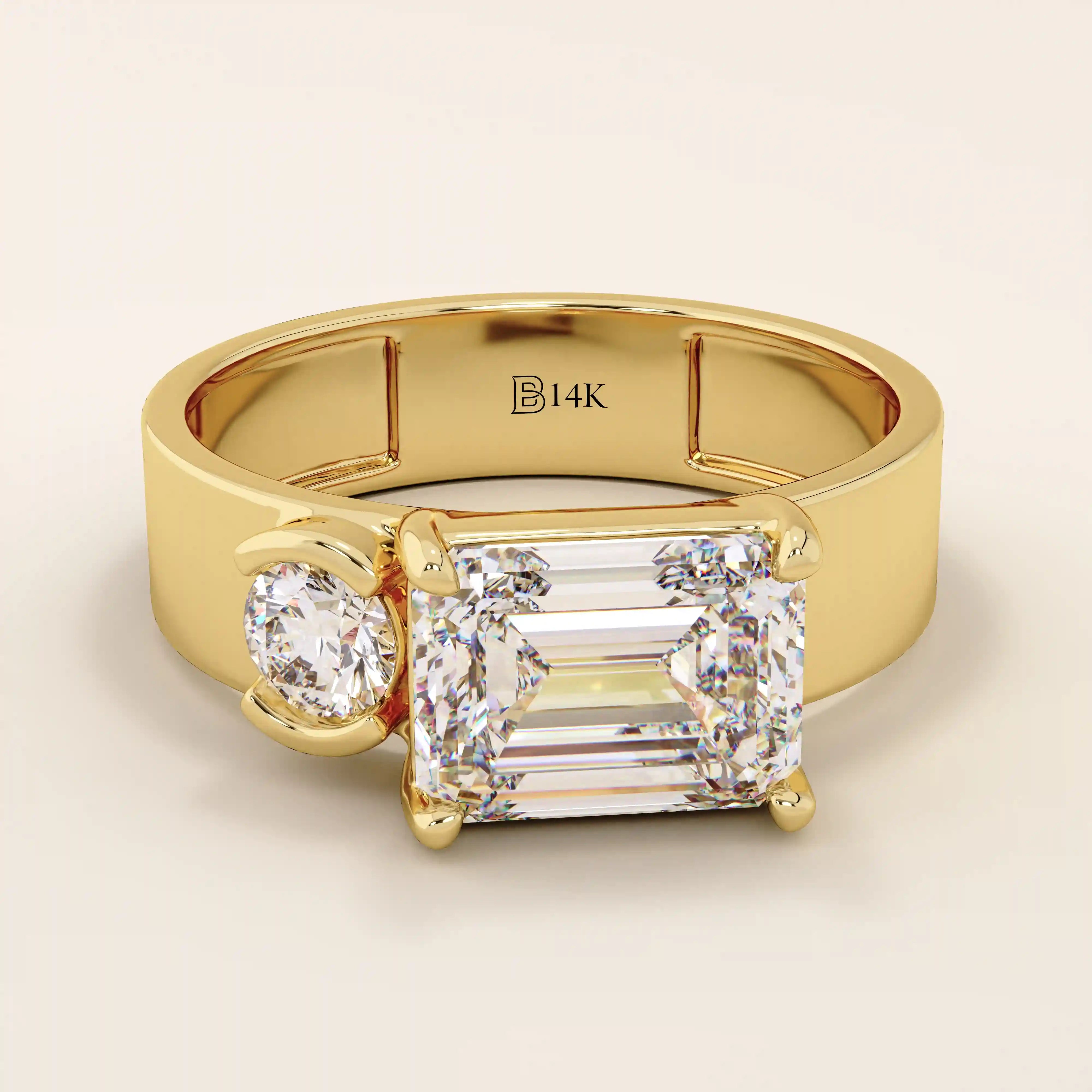 14k solid gold bold chunky Toi et Moi engagement ring featuring a prong-set emerald-cut moissanite and round-cut moissanites half bezel set. Modern, statement bridal design.
