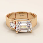 14k solid gold bold chunky Toi et Moi engagement ring featuring a prong-set emerald-cut moissanite and round-cut moissanites half bezel set. Modern, statement bridal design.