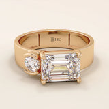 14k solid gold bold chunky Toi et Moi engagement ring featuring a prong-set emerald-cut moissanite and round-cut moissanites half bezel set. Modern, statement bridal design.