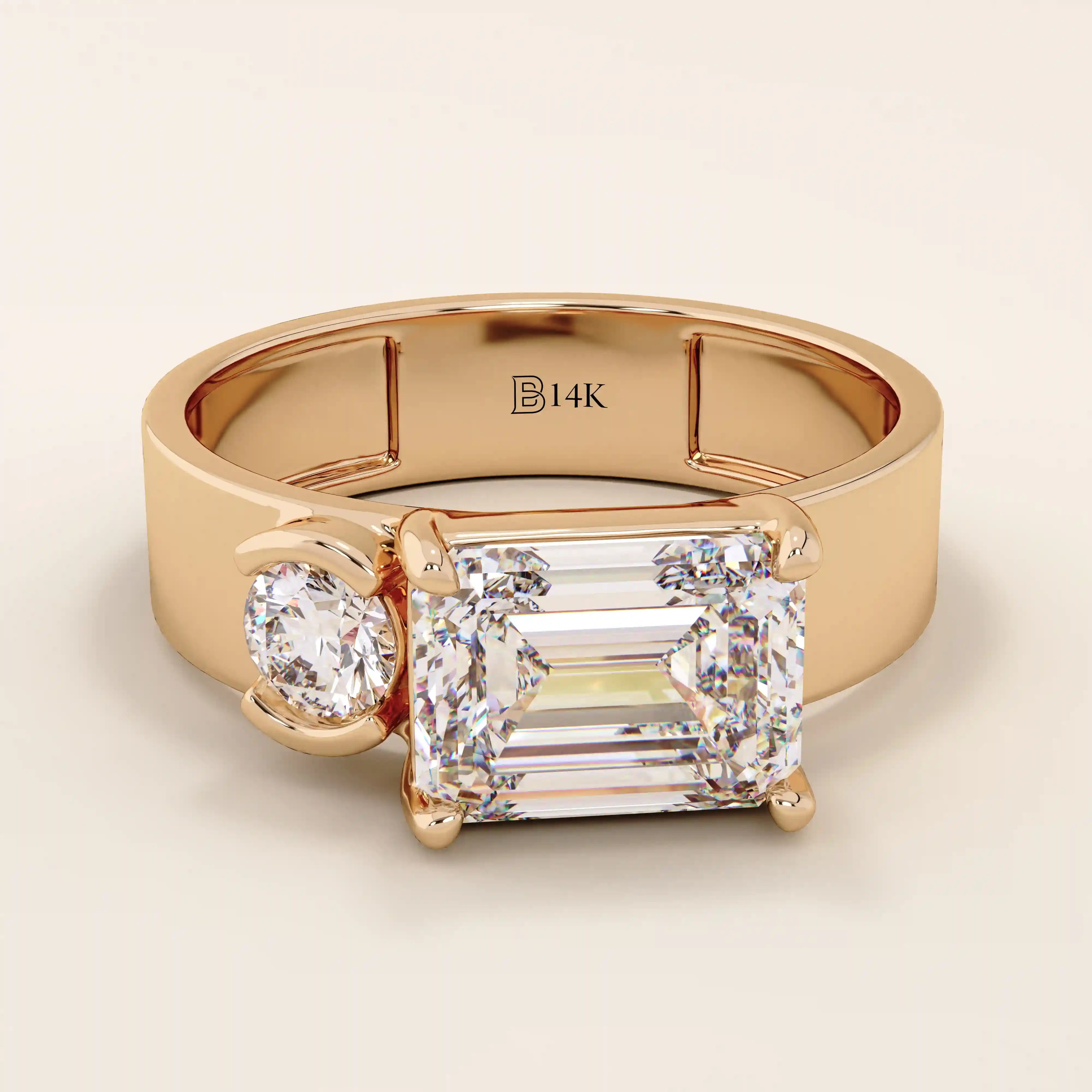 14k solid gold bold chunky Toi et Moi engagement ring featuring a prong-set emerald-cut moissanite and round-cut moissanites half bezel set. Modern, statement bridal design.