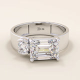 14k solid gold bold chunky Toi et Moi engagement ring featuring a prong-set emerald-cut moissanite and round-cut moissanites half bezel set. Modern, statement bridal design.