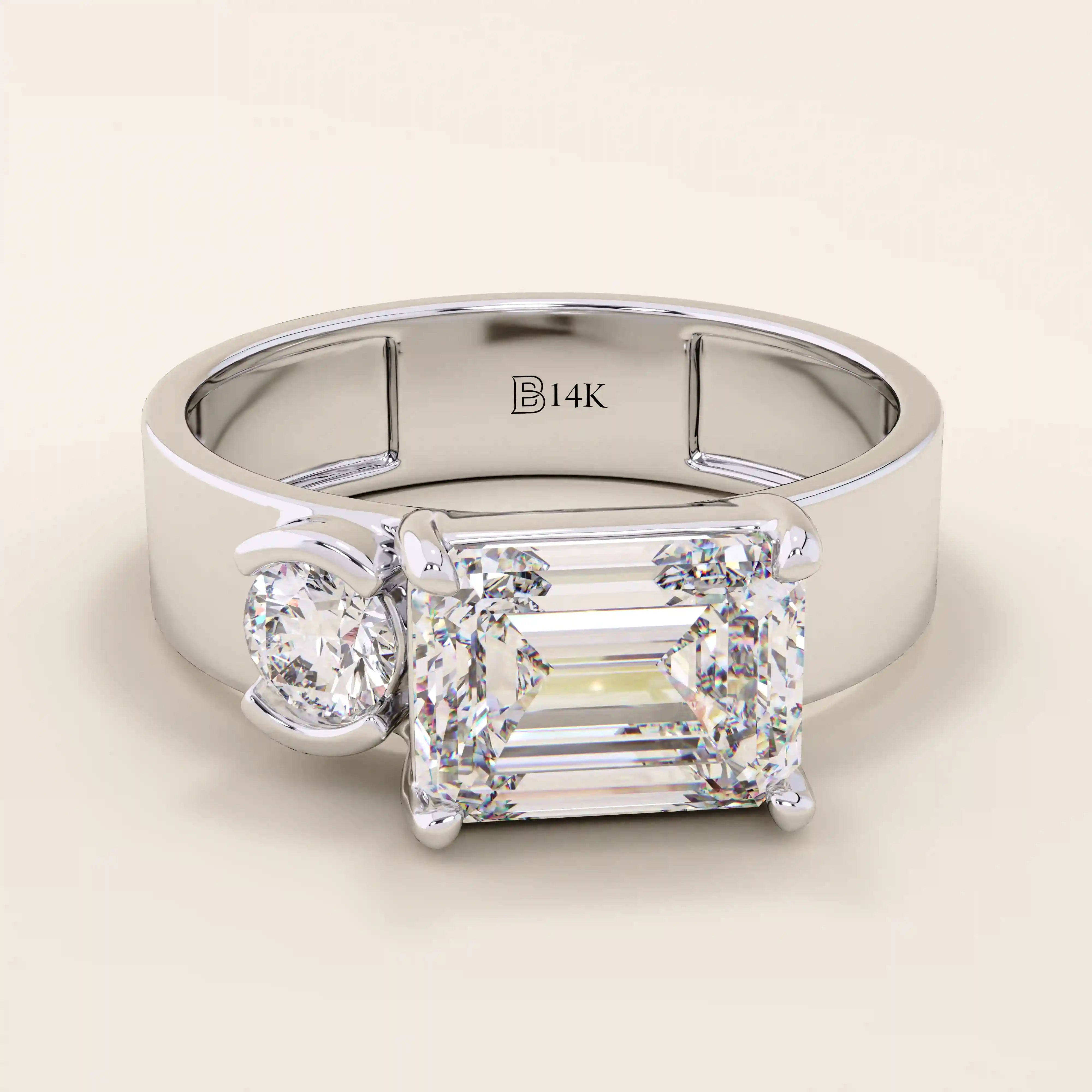 14k solid gold bold chunky Toi et Moi engagement ring featuring a prong-set emerald-cut moissanite and round-cut moissanites half bezel set. Modern, statement bridal design.