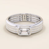 14k solid gold chunky engagement ring with a thick band, featuring bezel-set emerald-cut moissanites lining the band. Bold and modern design for statement bridal jewelry.