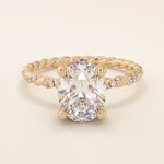 14k solid gold chunky solitaire engagement ring with an oval moissanite center stone. Modern and timeless design.