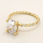 14k solid gold chunky solitaire engagement ring with an oval moissanite center stone. Modern and timeless design.
