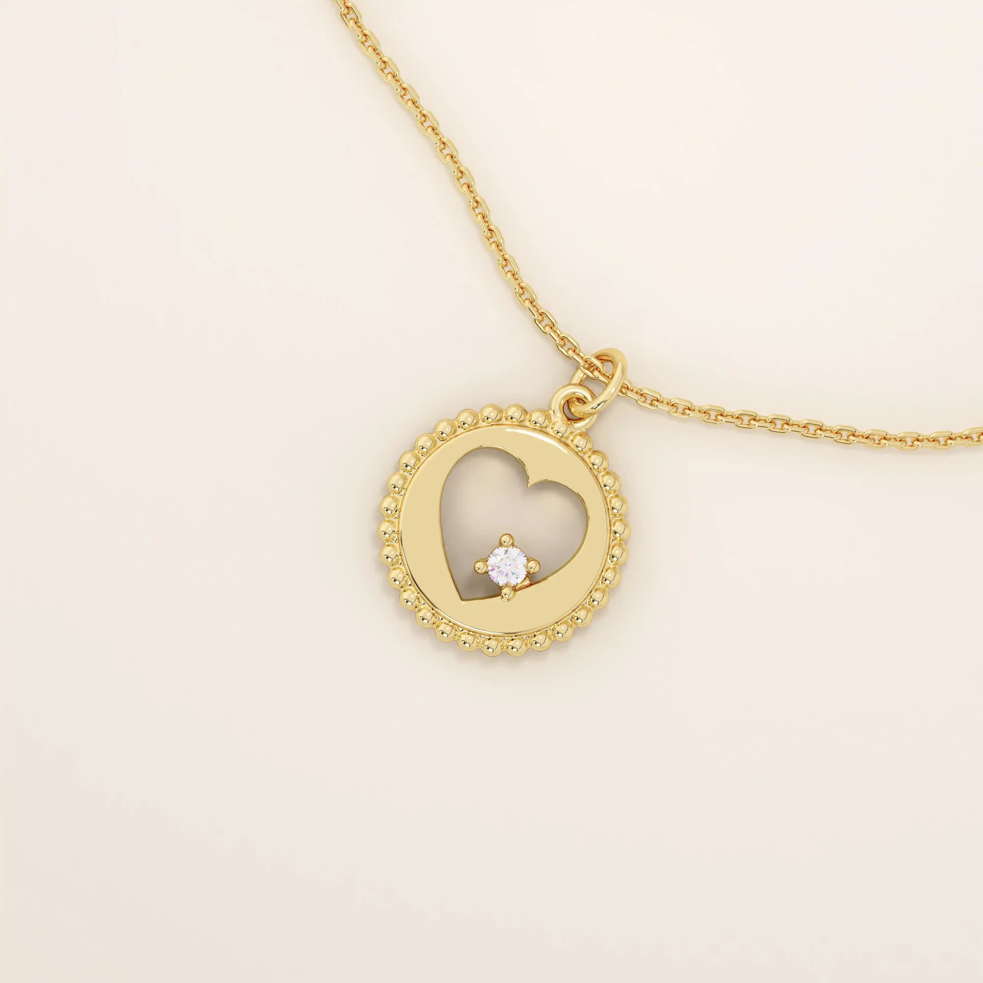 14k solid gold circle pendant necklace featuring a heart-shaped cutout and a single sparkling moissanite. Delicate and meaningful design.